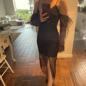Black with gold detail sheer with lining high low sleeved dress. Size S. New.